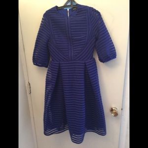 Fully lined pleated dress  with exposed zipper